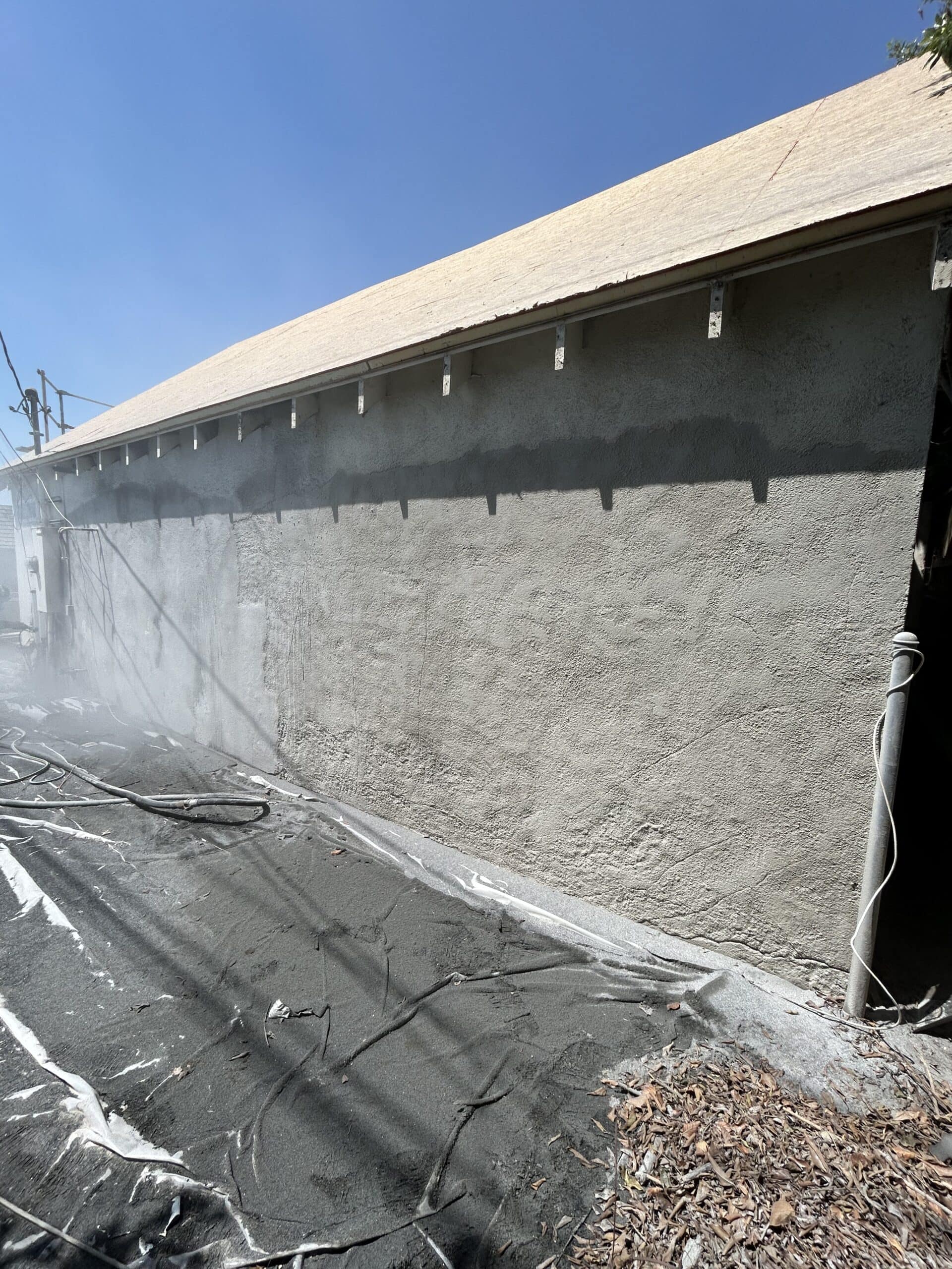 Dustless stucco sandblasting