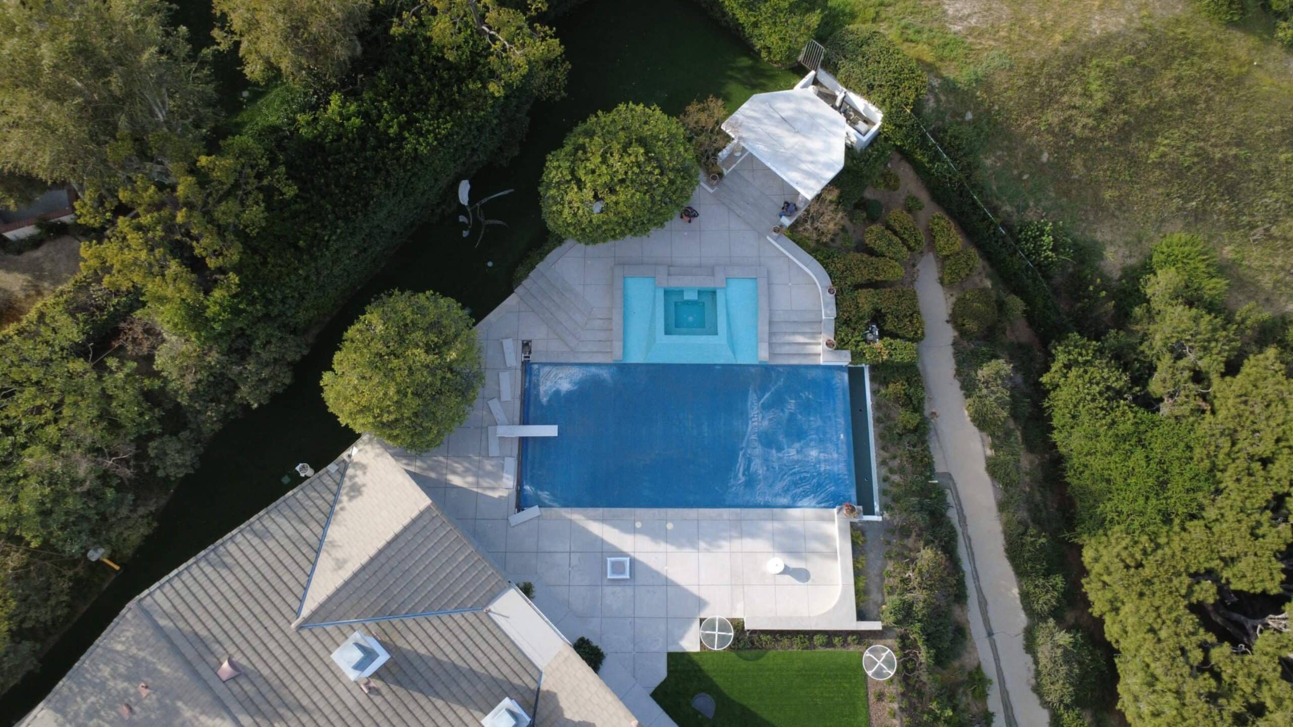 Sandblasting comcrete pool deck surface preparation in Calabasas, CA