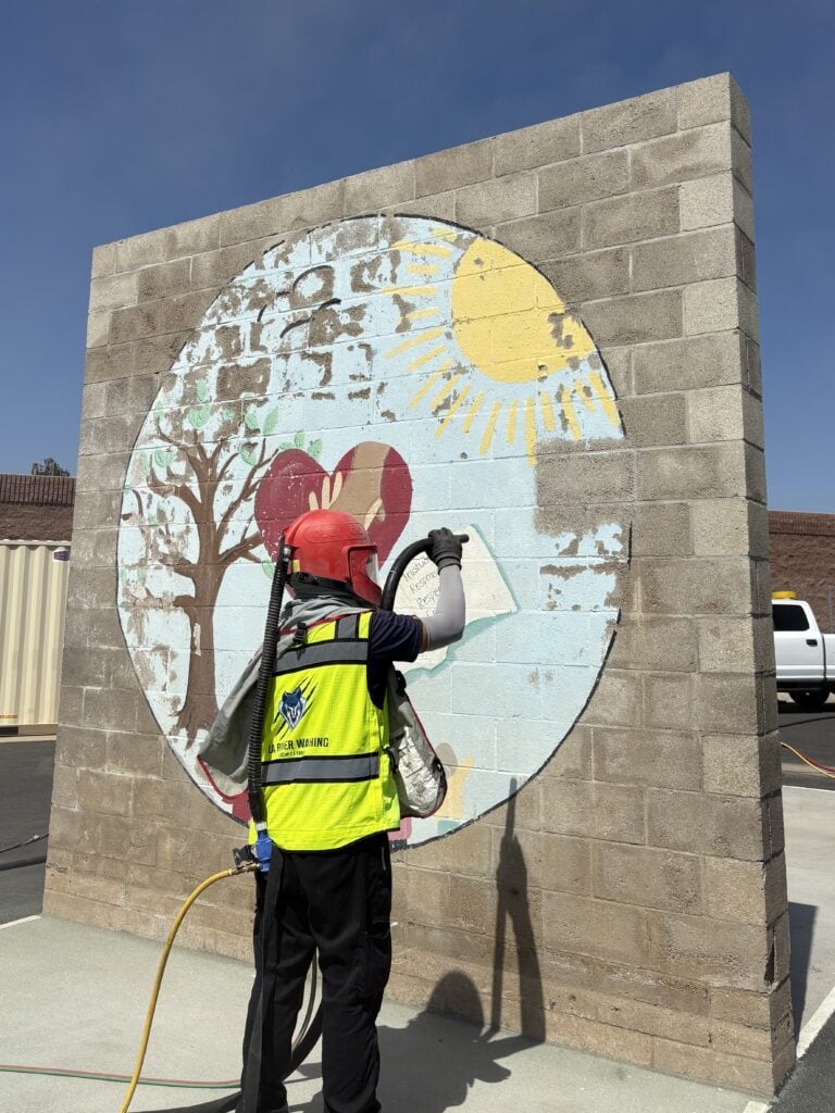 Brick wall sandblasting for paint removal at a school in Grand Terrace, CA