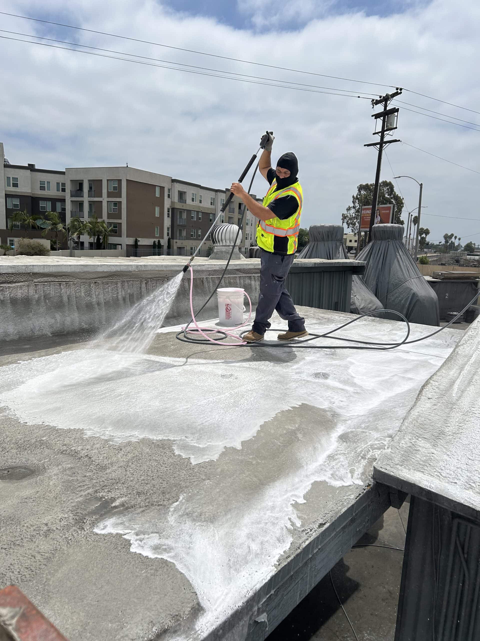 Commercial flat roof cleaning with professional washing equipment