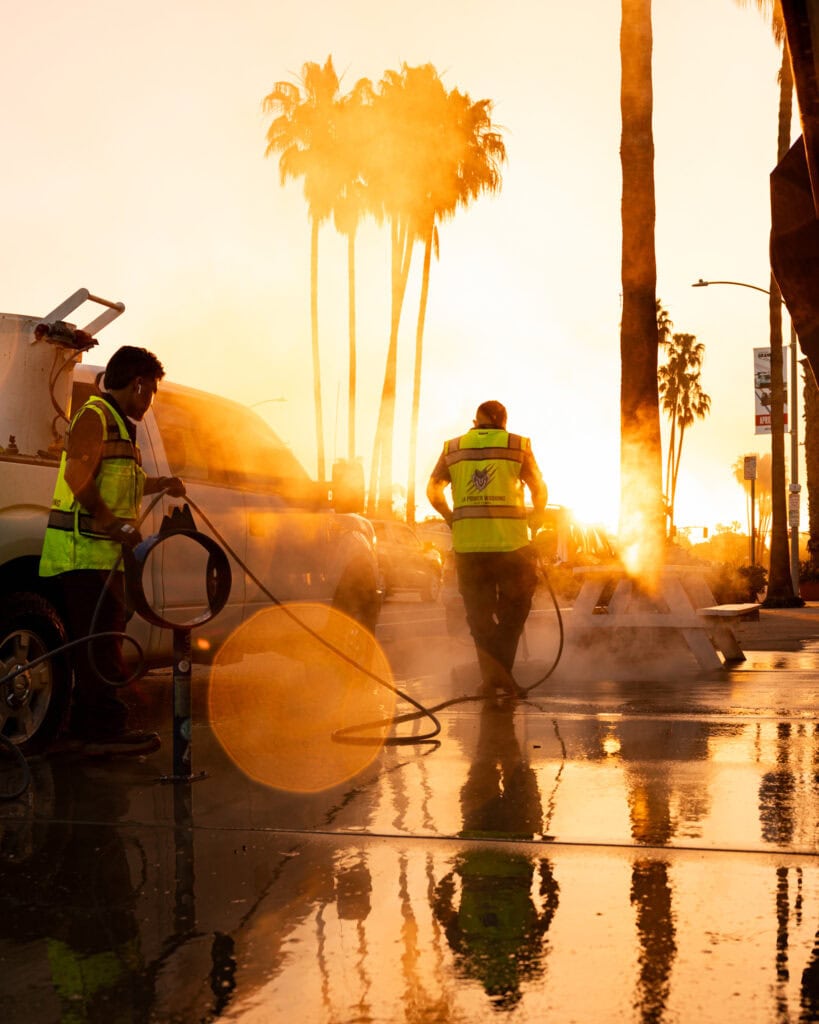 Commercial hot-water pressure washing of sidewalk in Long Beach, CA