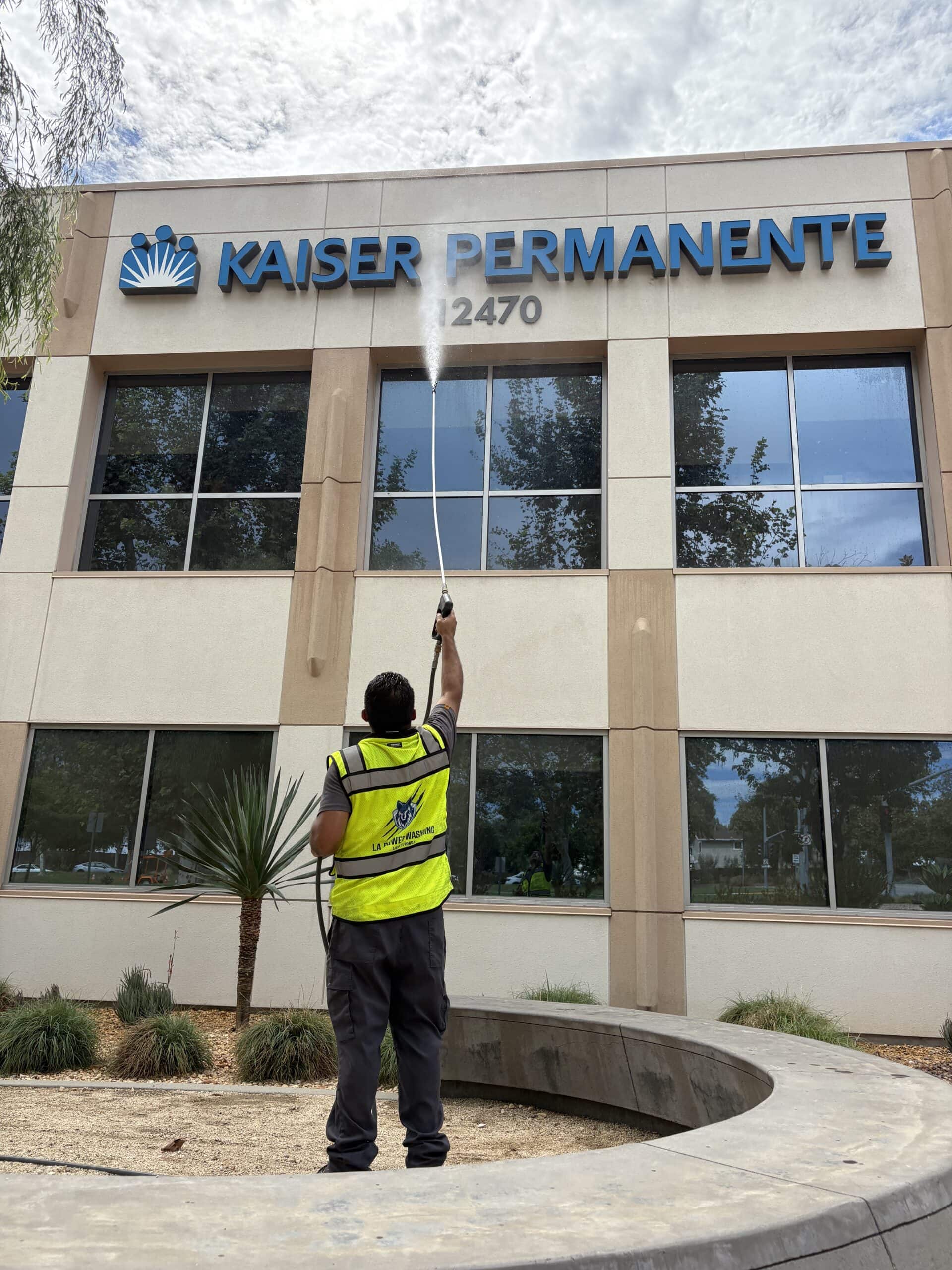 Commercial hot-water pressure washing of a building exterior in Whittier, CA