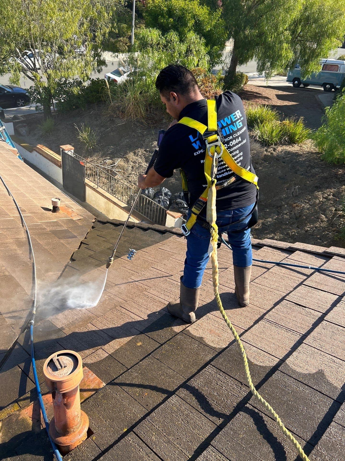Professional roof cleaning services removing algae and organic buildu in San Clemente, CA